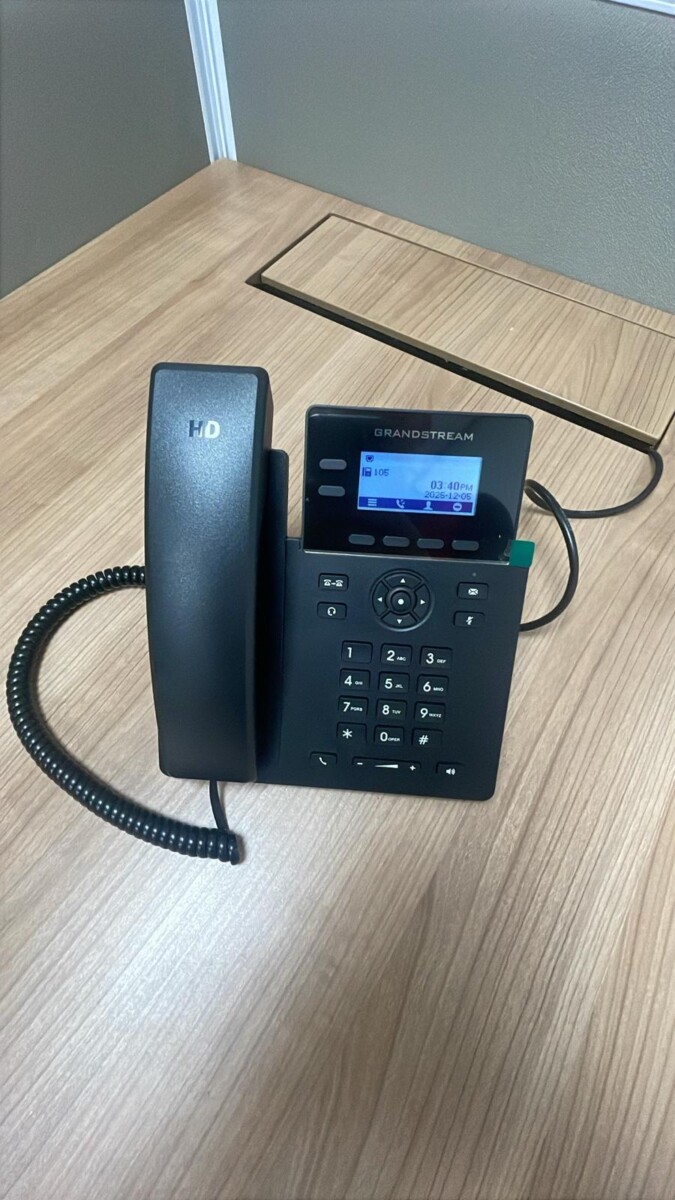 Close-up of office telephone handsets installed for business use