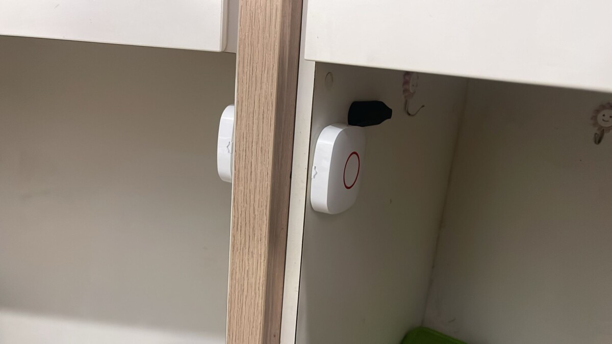 Panic buttons installed under a table for discreet emergency access